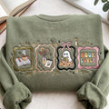 Ghost Book Lover Halloween Coquette Bow Candle Floral Frames embroidered sweatshirt — front view
