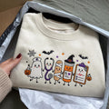 Halloween Nurse Ghost Stethoscope Mummy Pill Bottle Clipboard Spooky Crew embroidered sweatshirt — front view