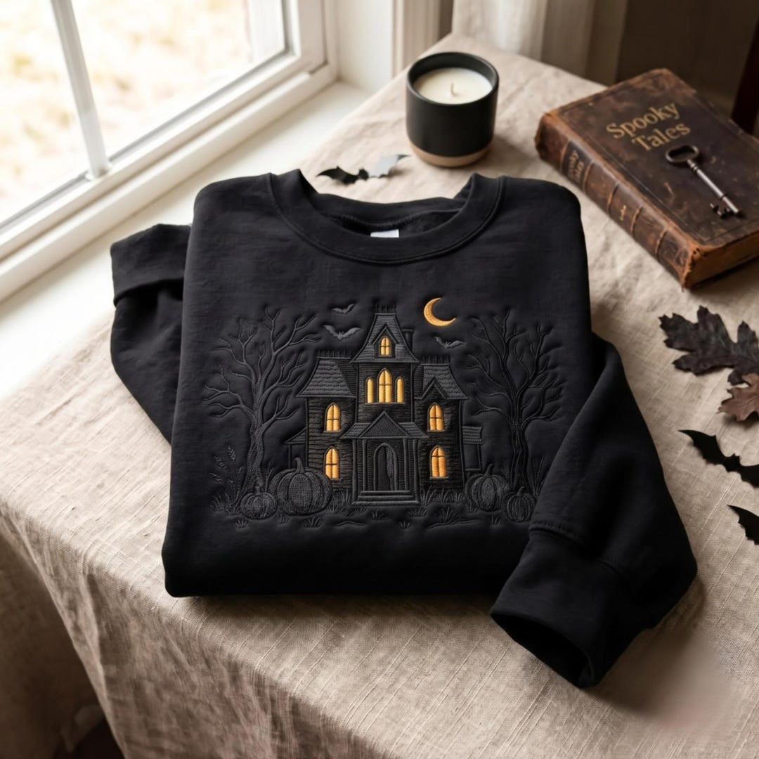 Halloween Haunted House Bats Crescent Moon Pumpkins Spooky Trees embroidered sweatshirt — front view