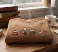 Book Lover Reading Otters Four Poses Cute Animal embroidered sweatshirt — front view