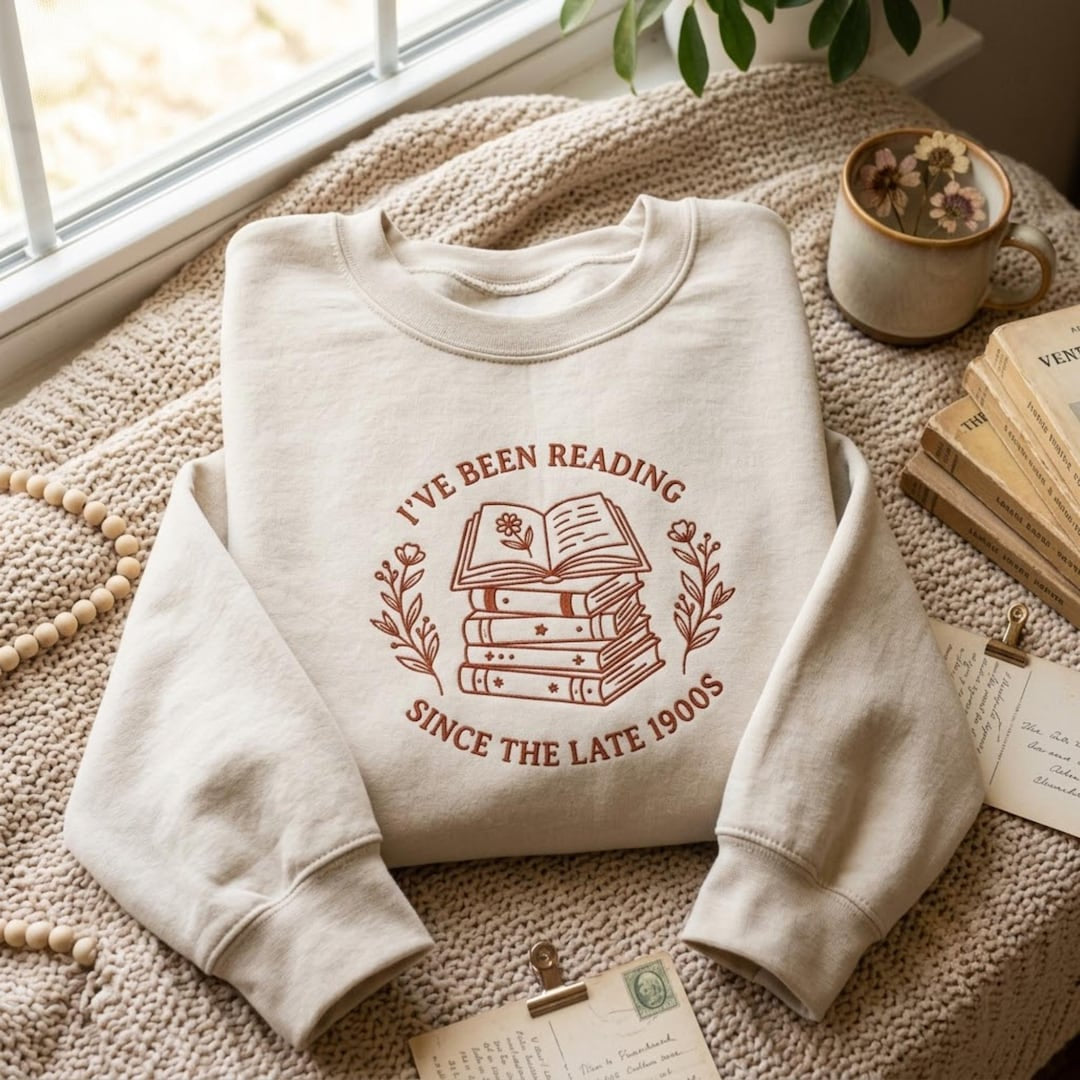 I've Been Reading Since the Late 1900s Stack Books Floral Wreath embroidered sweatshirt — front view
