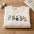Capybara Nurse Medical Team Scrubs IV Stand Cute Healthcare embroidered sweatshirt — front view