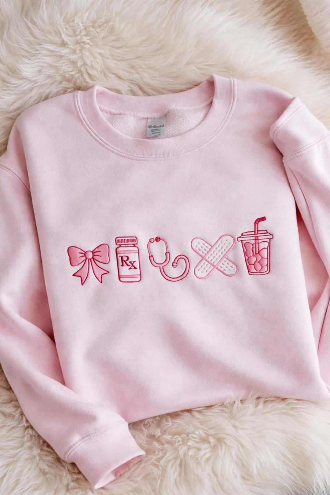 Nurse Coquette Bow Rx Pill Bottle Stethoscope Bandaid Iced Coffee Medical embroidered sweatshirt — front view