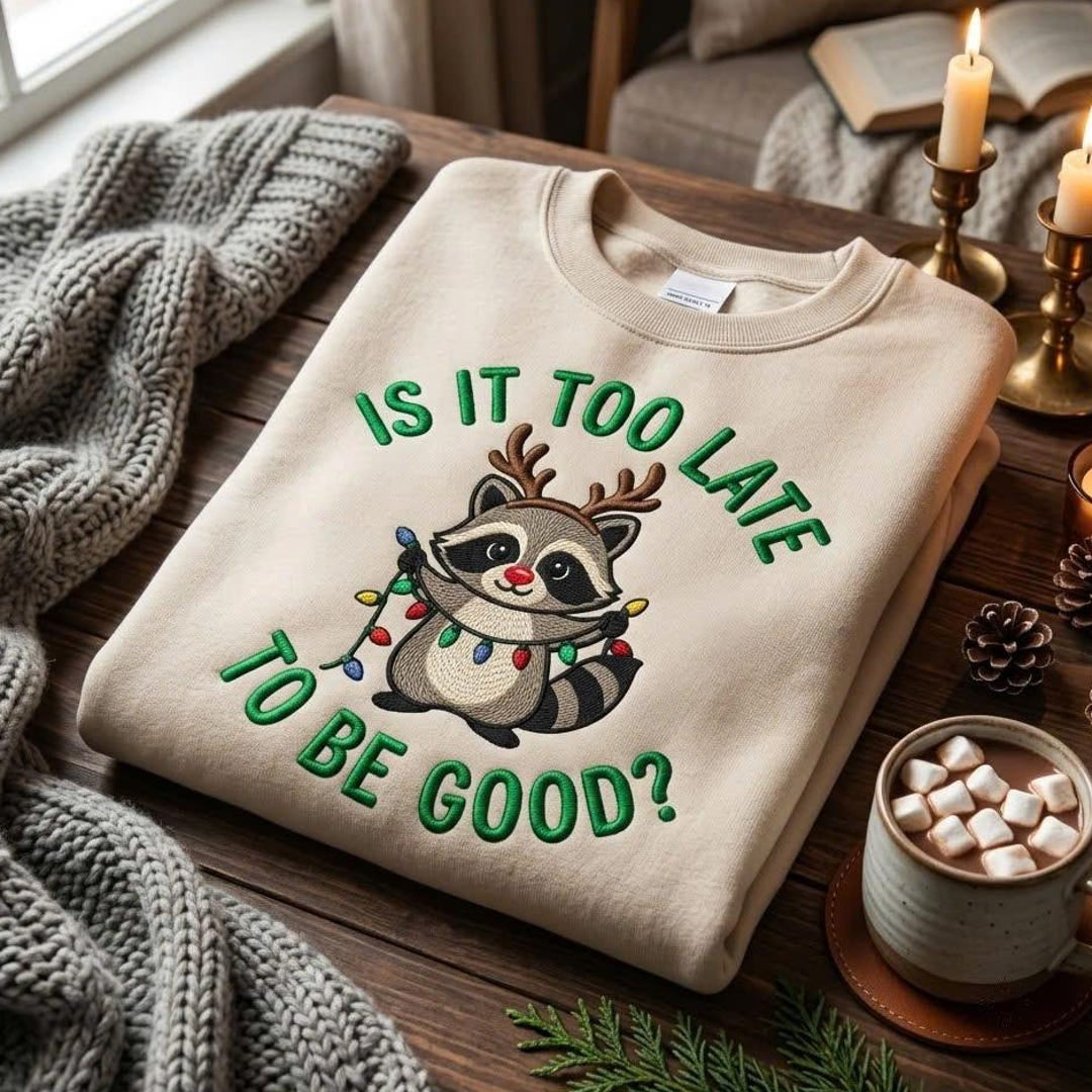 Funny Christmas Raccoon Reindeer Antlers Holiday Lights Is It Too Late to Be Good embroidered sweatshirt — front view