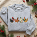 Christmas Chickens Santa Reindeer Lights Wreath Holiday Festive embroidered sweatshirt — front view