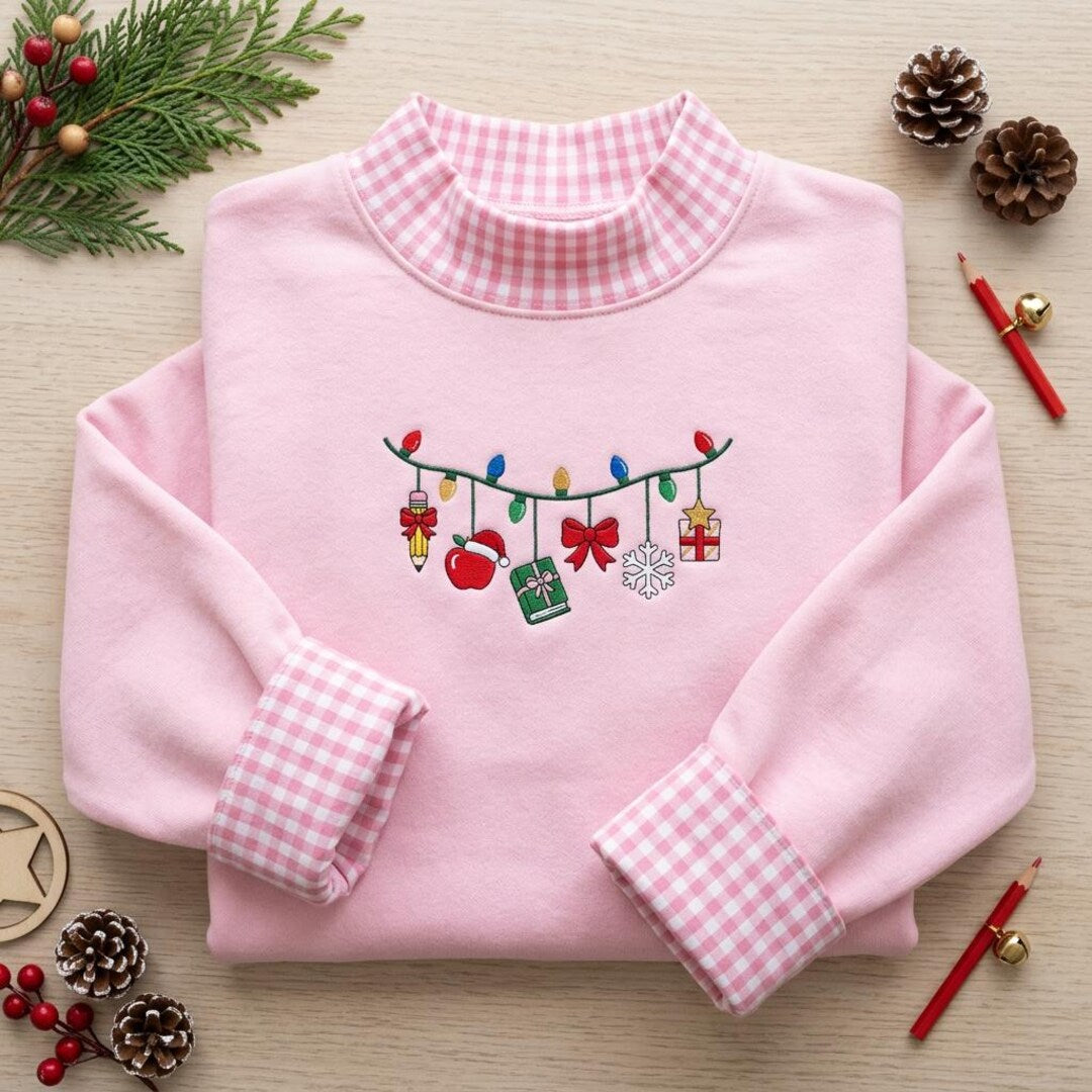 Teacher Christmas Lights Garland Apple Pencil Book Snowflake Gift embroidered sweatshirt — front view