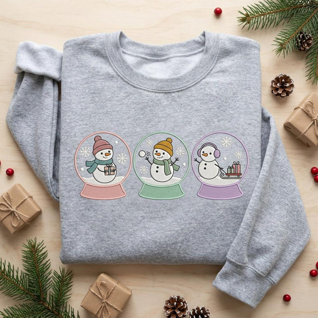 Three Snowman Snow Globe Pastel Christmas Winter Holiday embroidered sweatshirt — front view