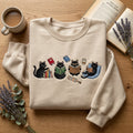 Black Cat Reading Books Coffee Bookmark Cozy Reader embroidered sweatshirt — front view