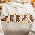 Fall Dachshund Five Poses Autumn Leaves Acorns Scarf Sweater Cozy Season embroidered sweatshirt — front view