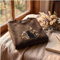 Black Cat Moon Stars Wildflowers Floral Night Sky embroidered sweatshirt — front view