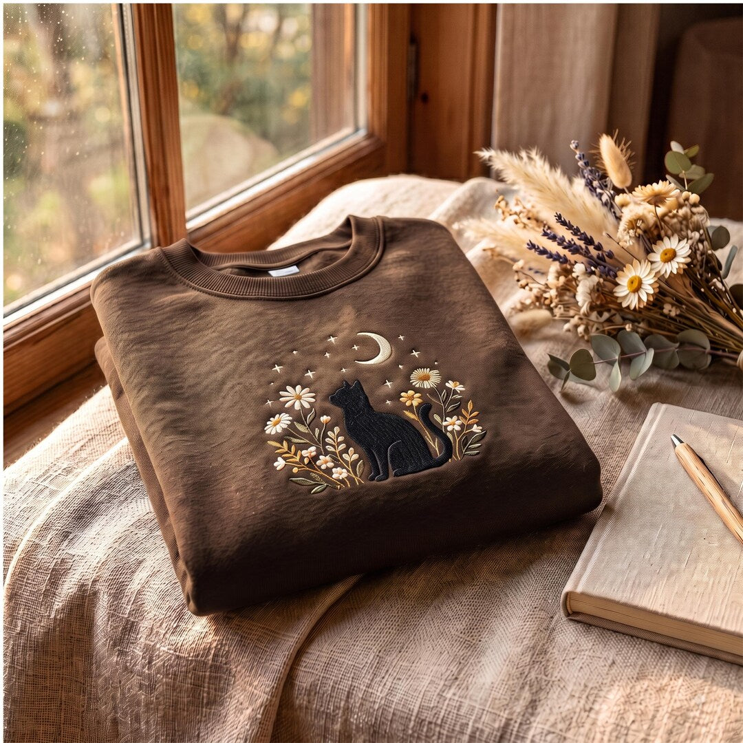Black Cat Moon Stars Wildflowers Floral Night Sky embroidered sweatshirt — front view