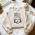 Halloween Skeleton Hands Heart Pregnancy Announcement Skelly in My Belly embroidered sweatshirt — front view