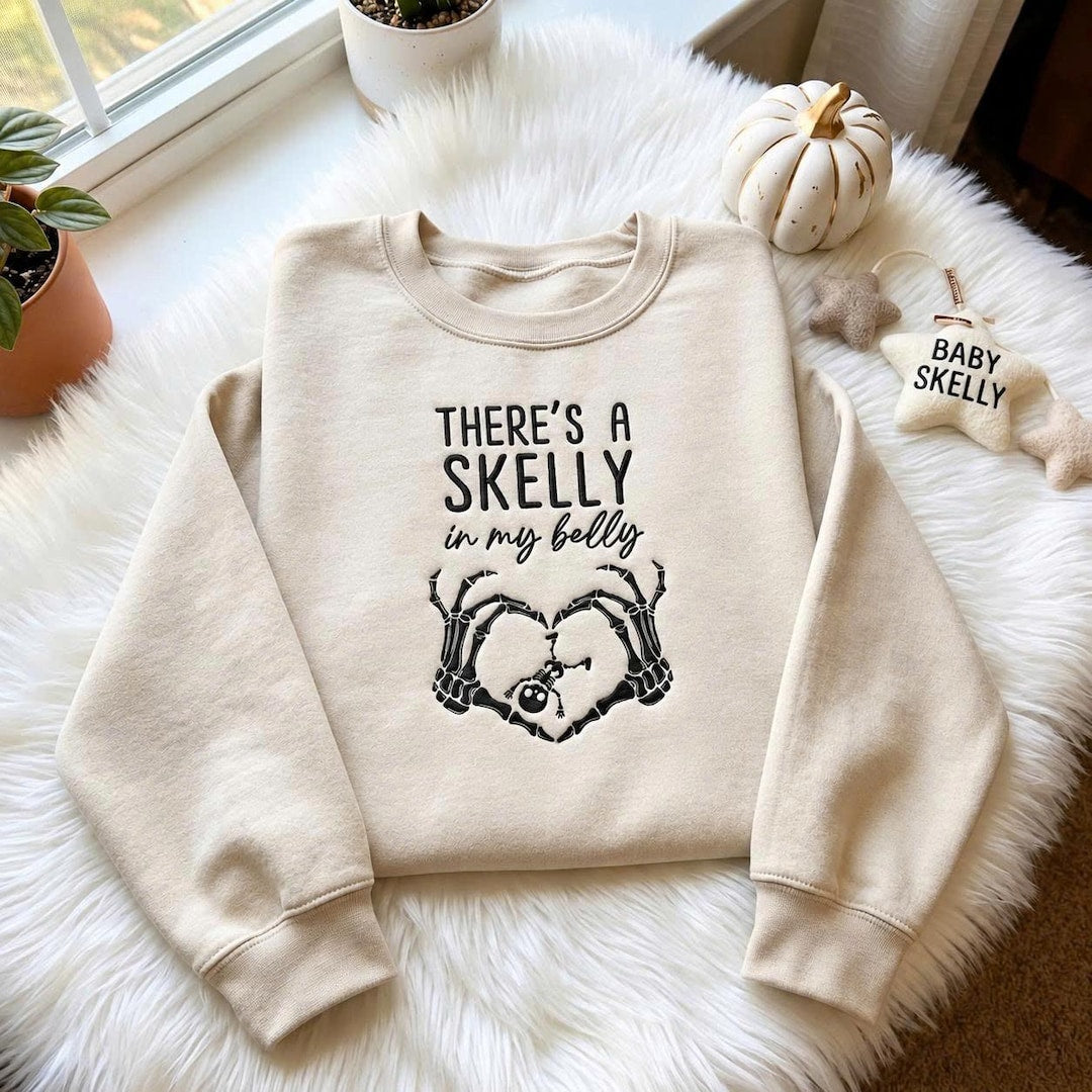 Halloween Skeleton Hands Heart Pregnancy Announcement Skelly in My Belly embroidered sweatshirt — front view