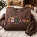 Christmas Gingerbread Snowman Reindeer Christmas Tree Candy Cane Bell String Lights embroidered sweatshirt — front view