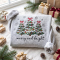 Christmas Three Trees Coquette Bows Ornaments Snowflakes Merry and Bright embroidered sweatshirt — front view