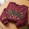 Personalized Christmas Nurse Stethoscope Heart Holiday Ornaments embroidered sweatshirt — front view