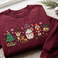Personalized Christmas Characters Reindeer Nutcracker Hot Cocoa Tree Bells embroidered sweatshirt — front view