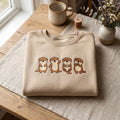 Four Sea Otters Cute Kawaii Poses embroidered sweatshirt — front view