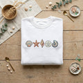 Sea Shells Starfish Sand Dollar Nautilus Coastal Beach embroidered sweatshirt — front view