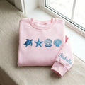 Personalized Sea Turtle Starfish Seashell Pearl Ocean Beach embroidered sweatshirt — front view