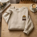 Cute Otter Wearing Beanie Cozy Left Chest embroidered sweatshirt — front view