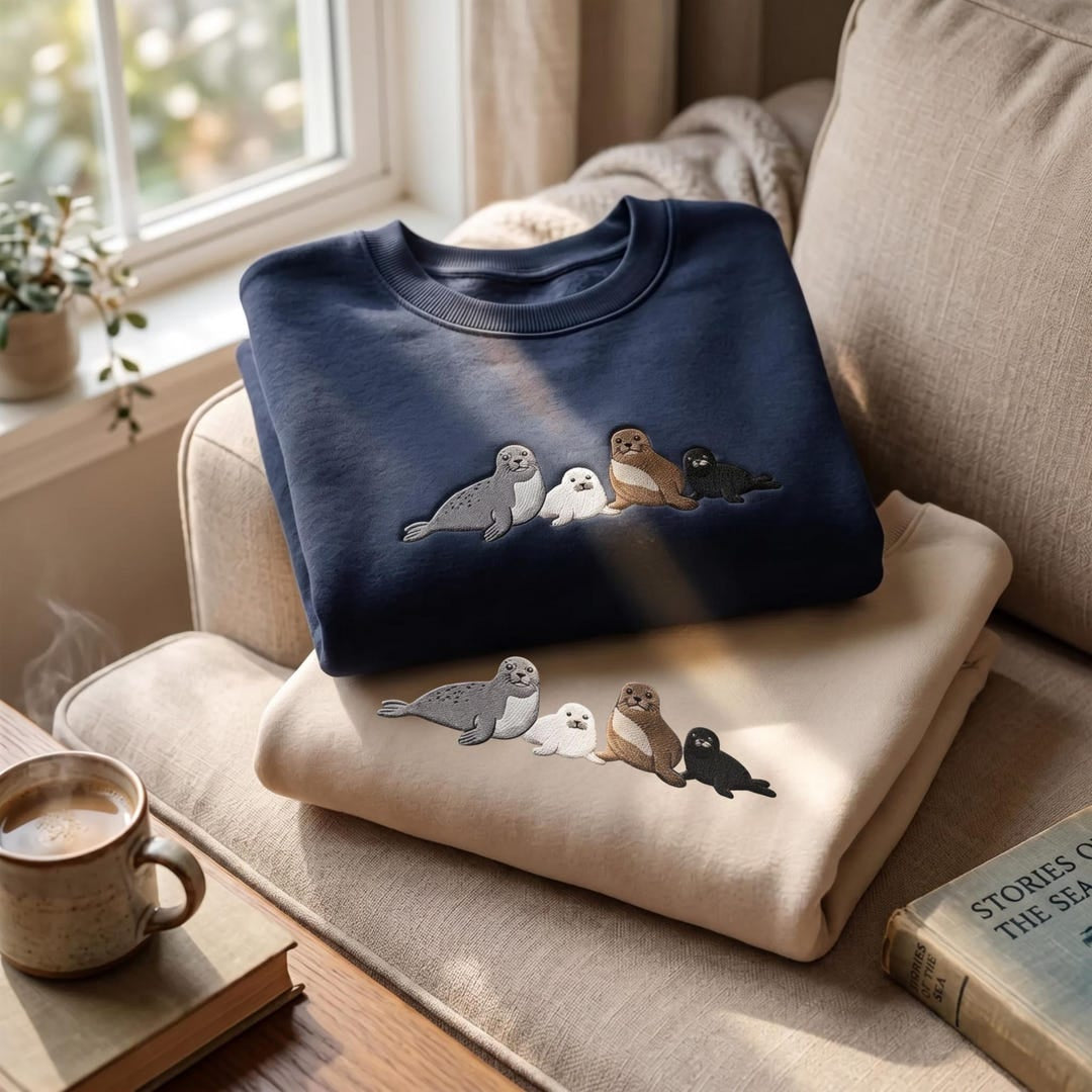 Four Baby Seals Lineup Ocean Marine Life embroidered sweatshirt — front view