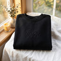 Personalized Tia Script Name embroidered sweatshirt — front view
