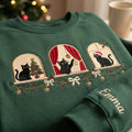 Personalized Black Cat Christmas Windows Garland Bow Custom Name embroidered sweatshirt — front view