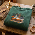 Personalized Halloween Witch Cat Reading Books Spooky Cats Bats Stars Custom Name embroidered sweatshirt — front view