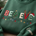 Personalized Believe Christmas Lights Tree Reindeer Santa Hat embroidered sweatshirt — front view