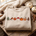 Autumn Robin Bird Mushroom Pumpkin Latte Fern Pine Fall embroidered sweatshirt — front view