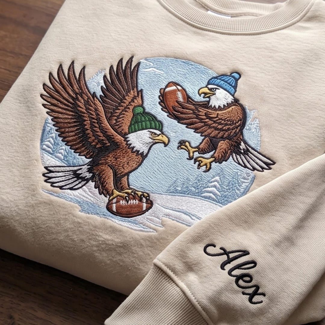 Personalized Bald Eagle Football Winter Beanie Hat Snow Scene embroidered sweatshirt — front view