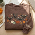 Personalized Halloween Bats Pumpkins Fall Leaves Sparkles Sleeve Name embroidered sweatshirt — front view
