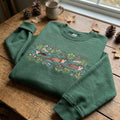 Otters Swimming Floral River Wildflowers Nature Lover embroidered hoodie — front view