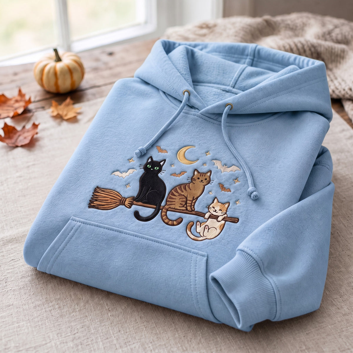 Three Cats Riding Witch Broom Crescent Moon Bats Halloween Embroidered Hoodie — Light Blue