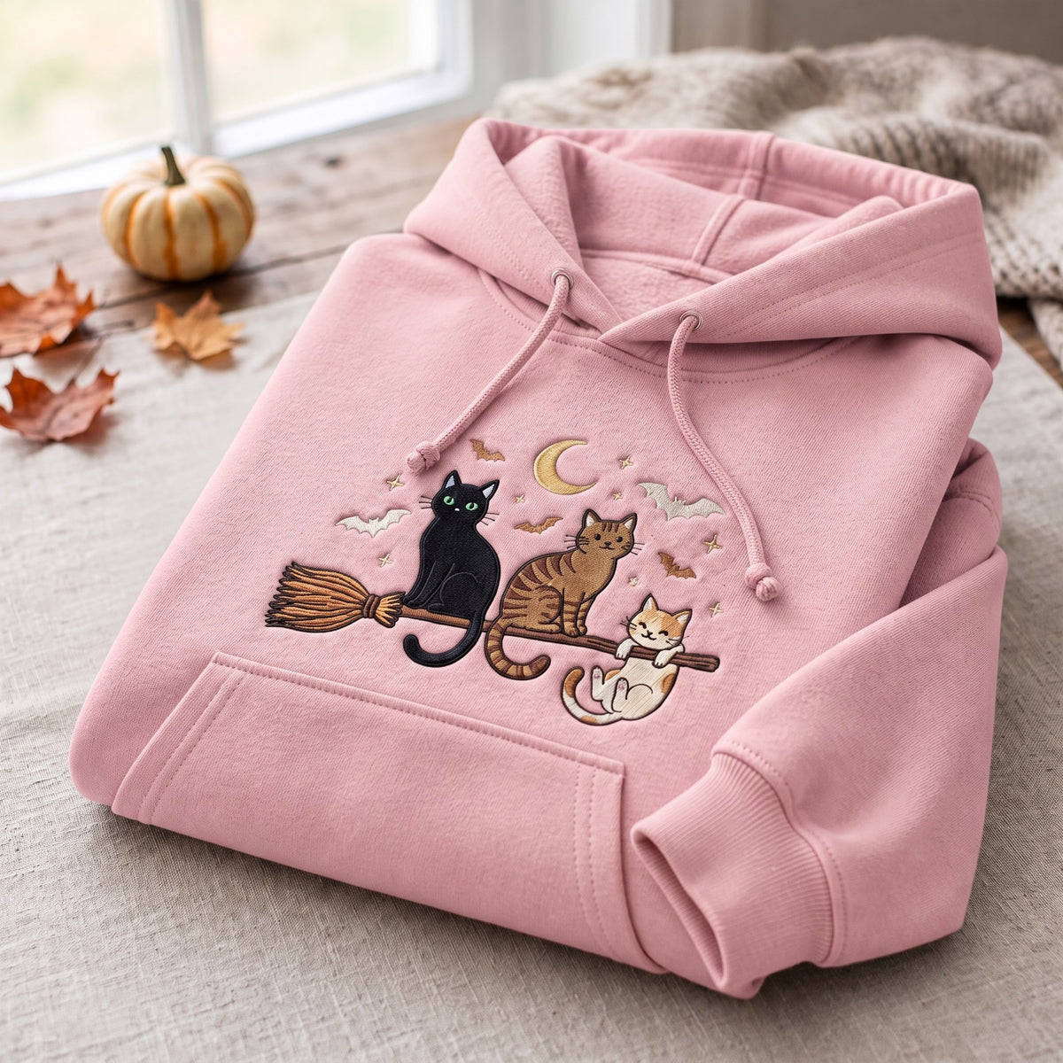 Three Cats Riding Witch Broom Crescent Moon Bats Halloween Embroidered Hoodie — Light Pink