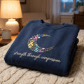 Awareness Ribbon Floral Crescent Moon Strength Through Compassion embroidered sweatshirt — front view