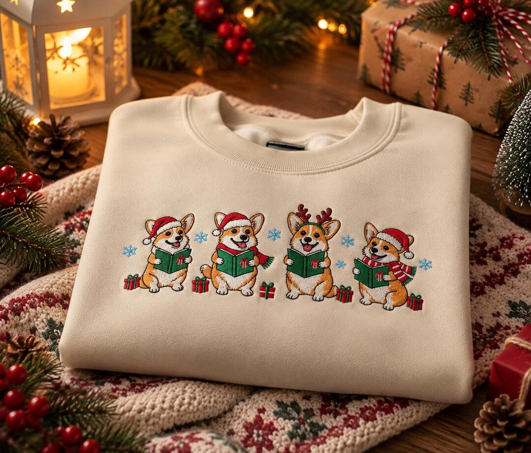 Christmas Corgi Choir Carol Book Santa Hat Reindeer Snowflake embroidered sweatshirt — front view
