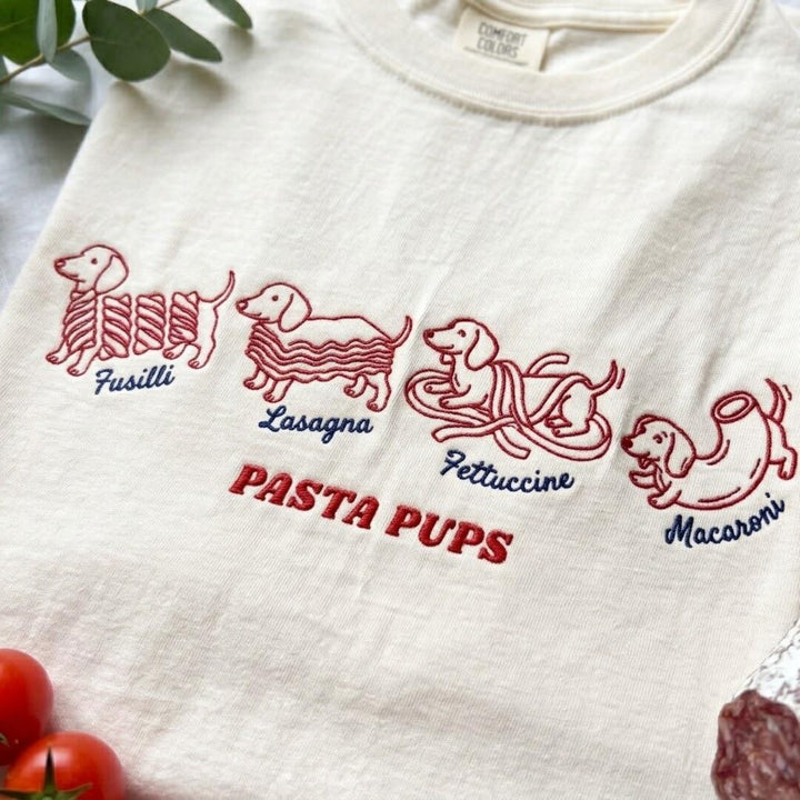 Pasta Pups Four Dachshunds Fusilli Lasagna Fettuccine Macaroni Funny Foodie embroidered t-shirt — front view