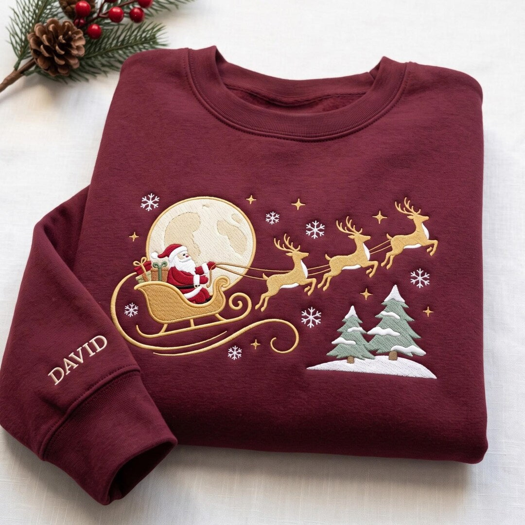 Personalized Santa Sleigh Flying Reindeer Moon Christmas Trees Snowflakes Custom Name embroidered sweatshirt — front view