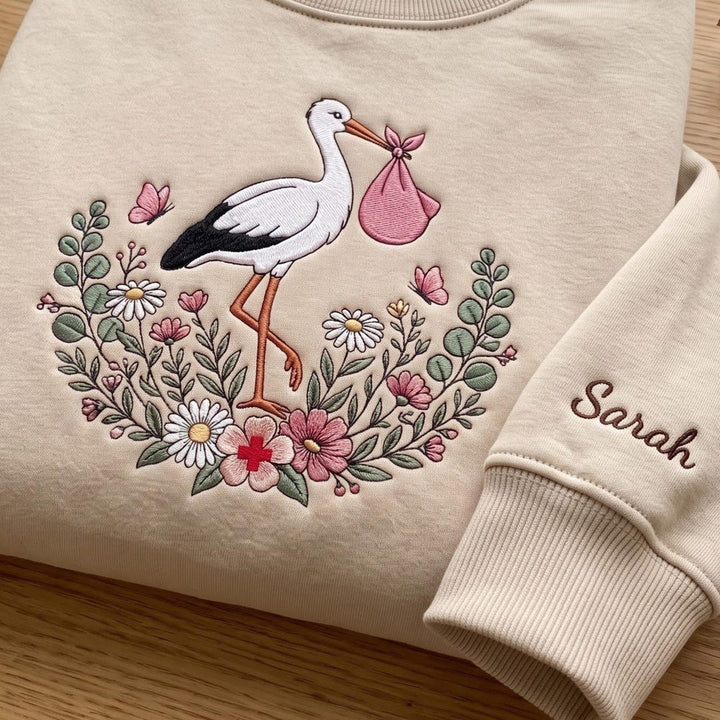 Personalized Labor Delivery Nurse Stork Floral Wildflower Custom Name embroidered sweatshirt — front view