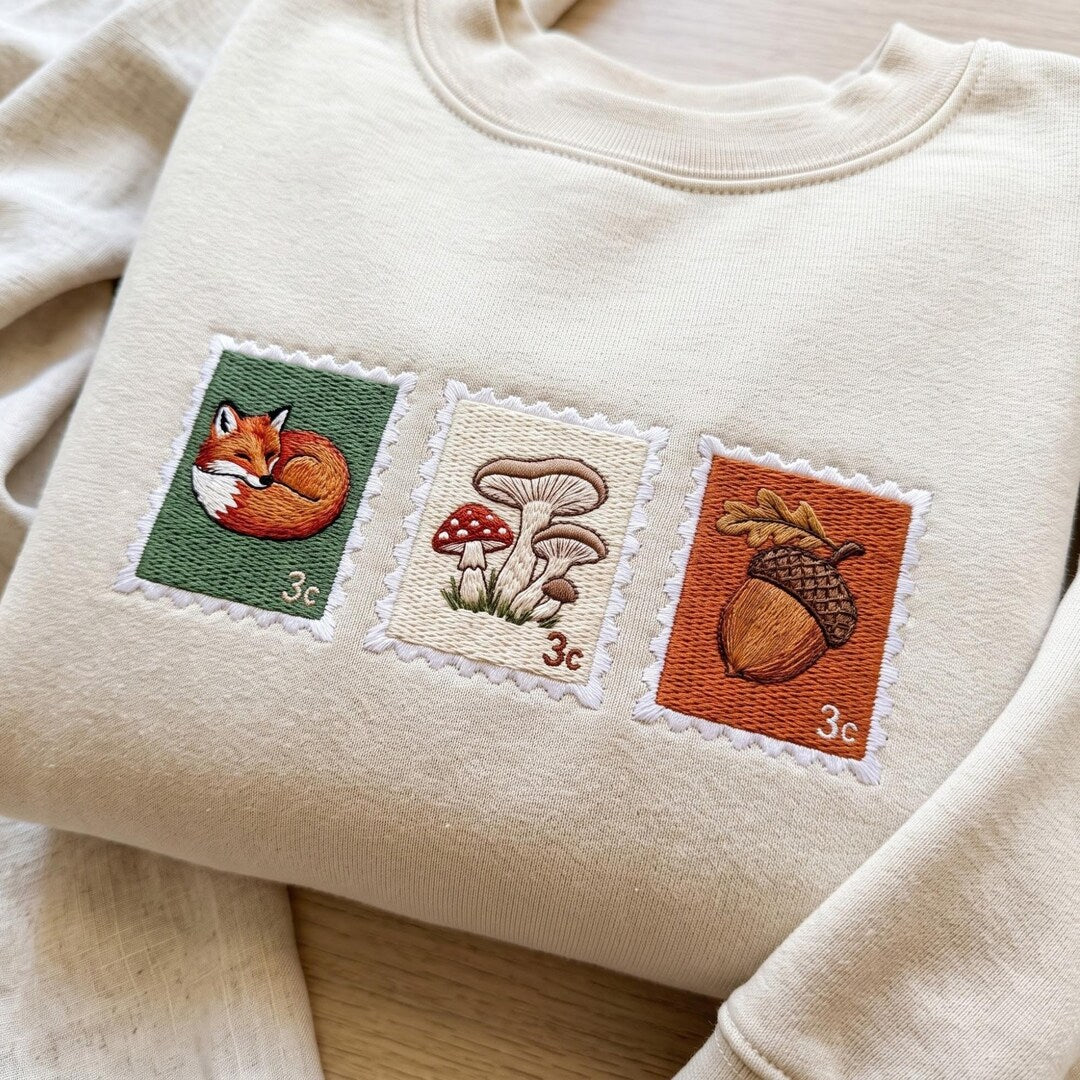 Fall Forest Postage Stamp Fox Mushroom Acorn Cottagecore embroidered sweatshirt — front view