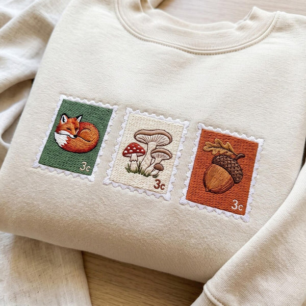 Fall Forest Postage Stamp Fox Mushroom Acorn Cottagecore embroidered sweatshirt — front view