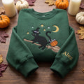 Personalized Halloween Black Cat Witch Hat Broomstick Pumpkin Moon Stars embroidered sweatshirt — front view