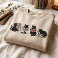 Black Cat Book Lover Reading Four Scenes Cozy embroidered sweatshirt — front view