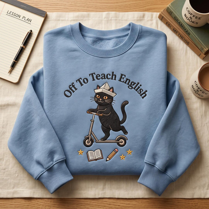 Off to Teach English Black Cat Scooter Paper Hat Book Pencil Stars embroidered sweatshirt — front view