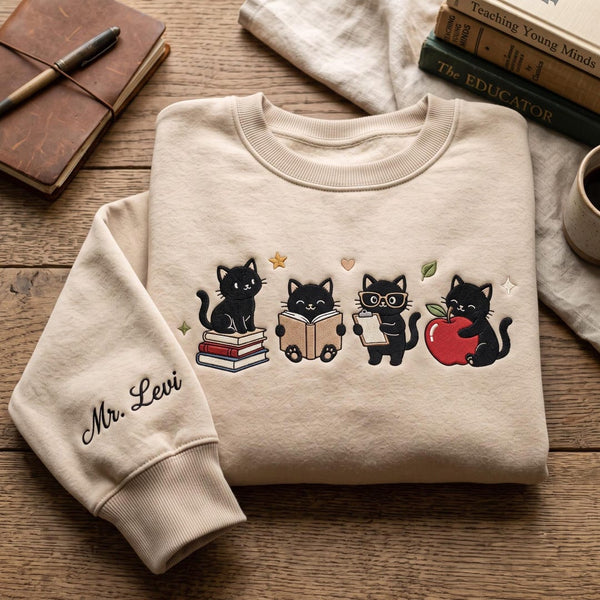 Personalized Teacher Black Cat Reading Book Apple Clipboard Four Cats Custom Name embroidered sweatshirt — front view