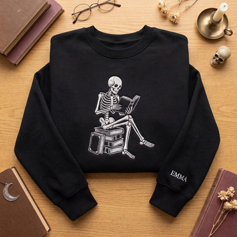 Personalized Skeleton Reading Books Halloween Gothic Bookworm embroidered sweatshirt — front view