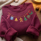 Christmas Charm Necklace Garland Gingerbread Bell Candy Cane Wreath embroidered sweatshirt — front view
