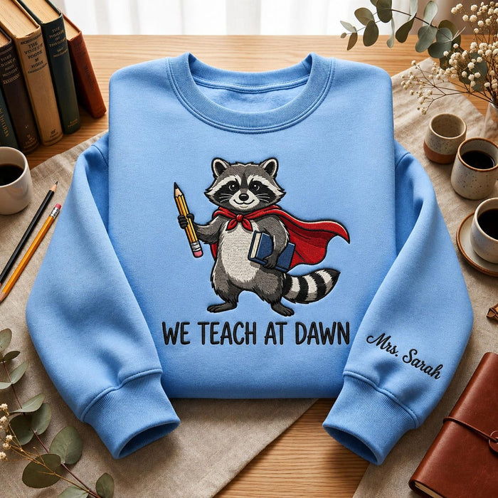 Personalized We Teach at Dawn Superhero Raccoon Teacher Cape Pencil Book Embroidered Sweatshirt